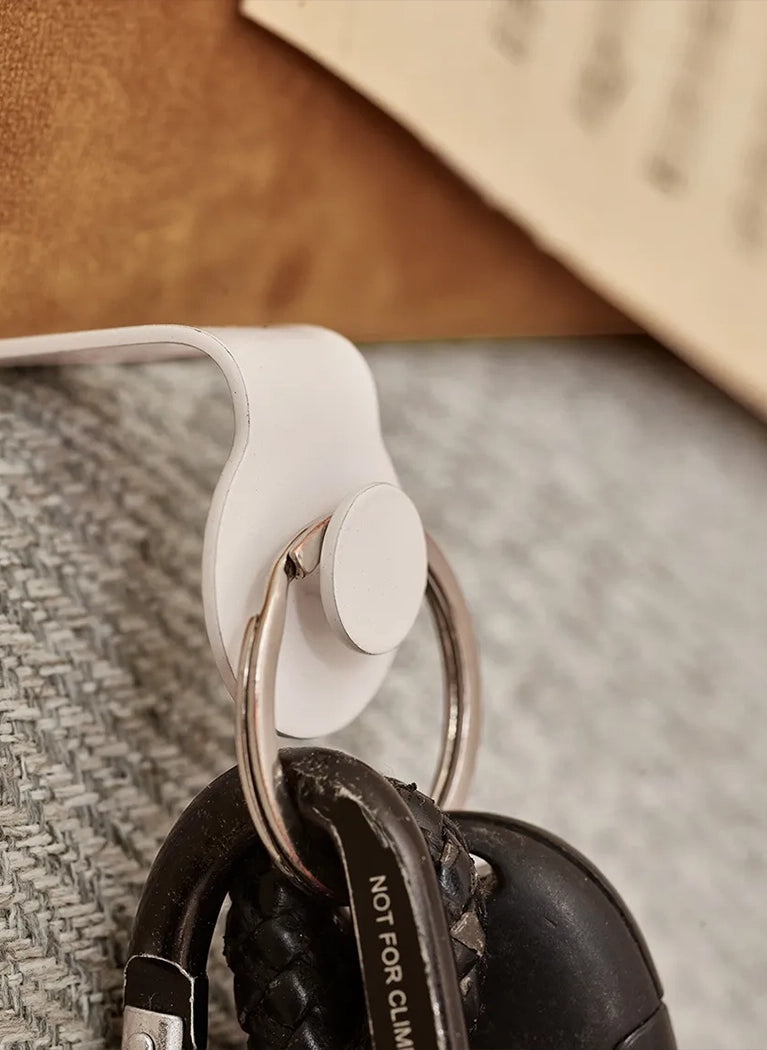 Padded Wall Boards Accessories - Elastic closeup of hook on grey panel Decormania UK